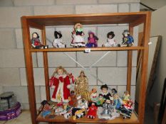 2 shelves of porcelain dolls etc.