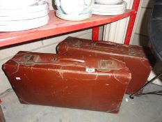 2 vintage suitcases.