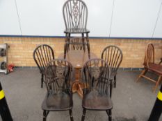 6 wheelback chairs and a round table.