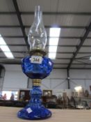 A blue glass oil lamp.