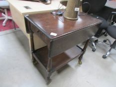 An oak tea trolley.