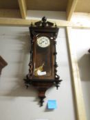 A mahogany wall clock.