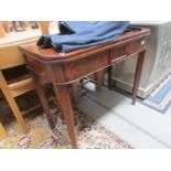 A mahogany fold over table.