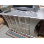 A silver coloured 3 drawer chest.