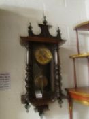 A mahogany wall clock.