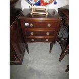 A mahogany 3 drawer chest.