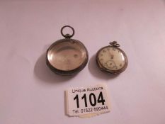 A ladies silver fob watch and a silver watch case.