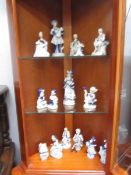 3 shelves of blue and white figures.