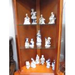 3 shelves of blue and white figures.