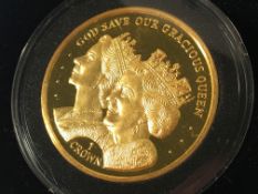 The Queen Elizabeth II 90th birthday pure gold diamond set proof one crown coin.