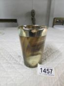 A horn beaker with polished rim,