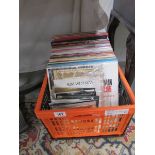 A box of 45 rpm and LP records.