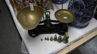 2 sets of brass scales and weights.