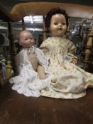 An AM 'Dream Baby' doll and a 1950's composition doll.