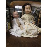 An AM 'Dream Baby' doll and a 1950's composition doll.