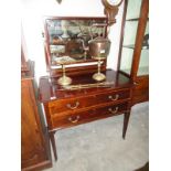 A mahogany inlaid dressing table.