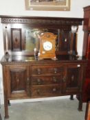 An oak mirror backed sideboard.