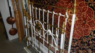 A Victorian brass and iron bed.