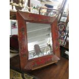 A Chinese style framed mirror.