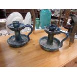 A pair of studio pottery candlesticks.