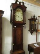 An oak cased long case clock with painted dial.