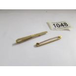 2 9ct gold tie pins, 5 grams.