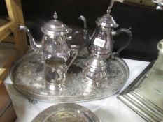 A 4 piece silver plate tea set on tray.