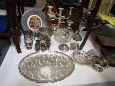 A mixed lot of silver plate including candelabra.