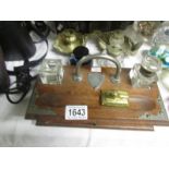 An inkstand and 3 inkwells.