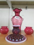 A cranberry glass vase,