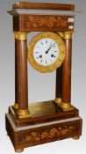 A French inlaid clock on stand.