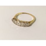 A 5 stone yellow gold diamond ring, size M.