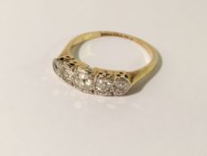 A 5 stone yellow gold diamond ring, size M.