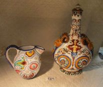 An Italian flask with mask head handles (slight chips to both masks) and an Italian hand painted