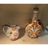 An Italian flask with mask head handles (slight chips to both masks) and an Italian hand painted