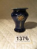 A miniature Royal Doulton art nouveau vase.