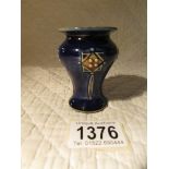 A miniature Royal Doulton art nouveau vase.