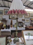 A tall gilt and onyx table lamp.