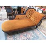 A mahogany chaise longue.