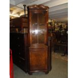 A mahogany corner cabinet.