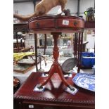 A mahogany drum table.