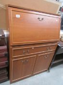 A teak bureau.