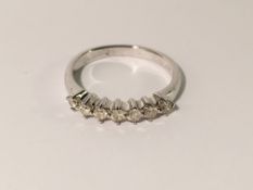 A 7 stone 35 point 18ct white gold diamond ring, size L.