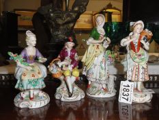 4 Continental porcelain figures.
