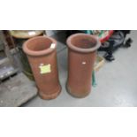 A pair of terracotta chimney pots.