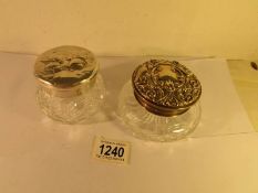 2 glass powder bowls with hall marked silver tops (one depicting cherubs).