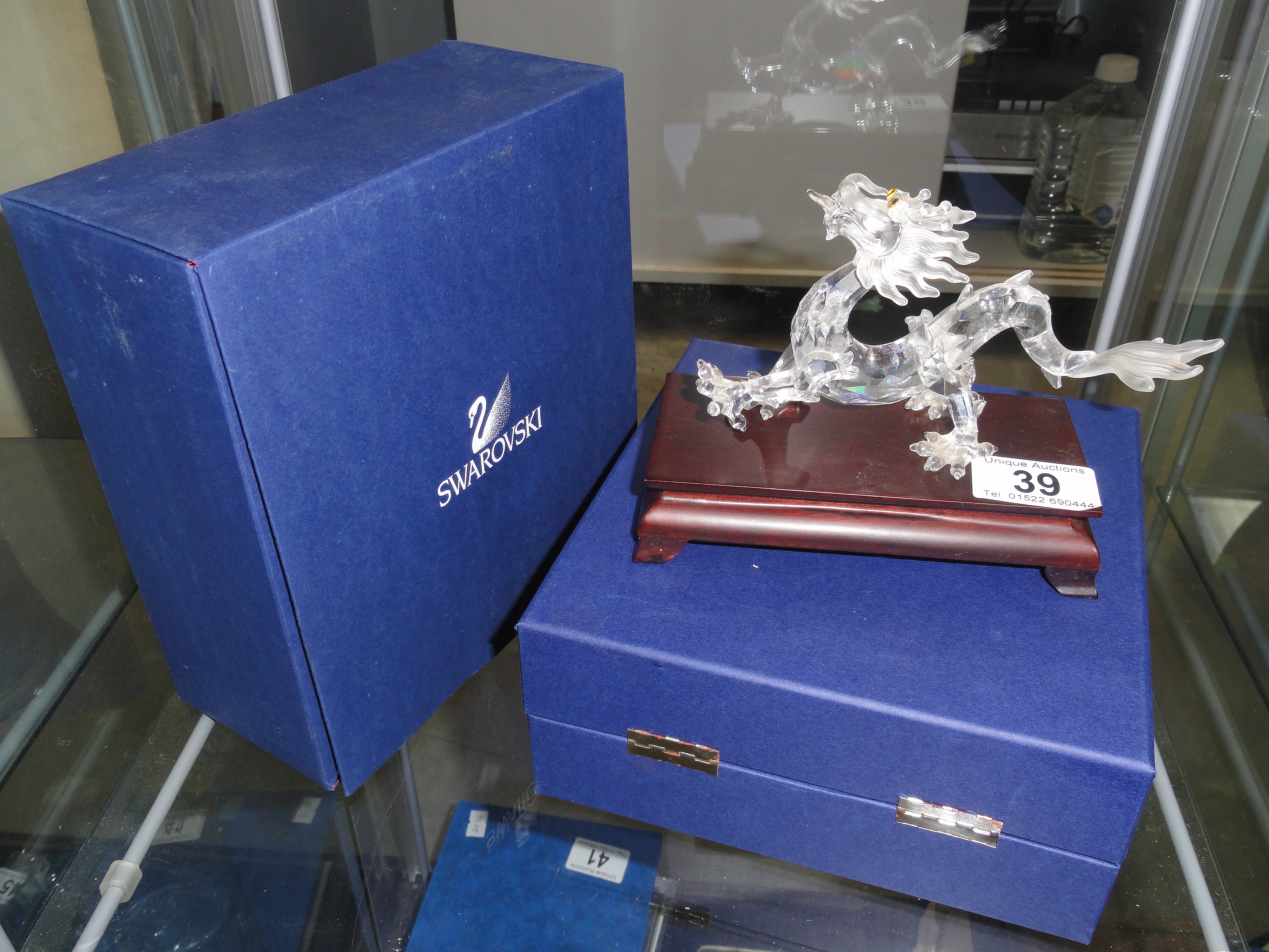 A Swarovski crystal figure of a dragon from the crystal zodiac series with box.