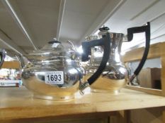 A Silver plated tea pot and coffee pot.