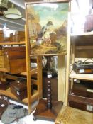 A Victorian mahogany pole screen with tapestry inset.