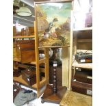 A Victorian mahogany pole screen with tapestry inset.